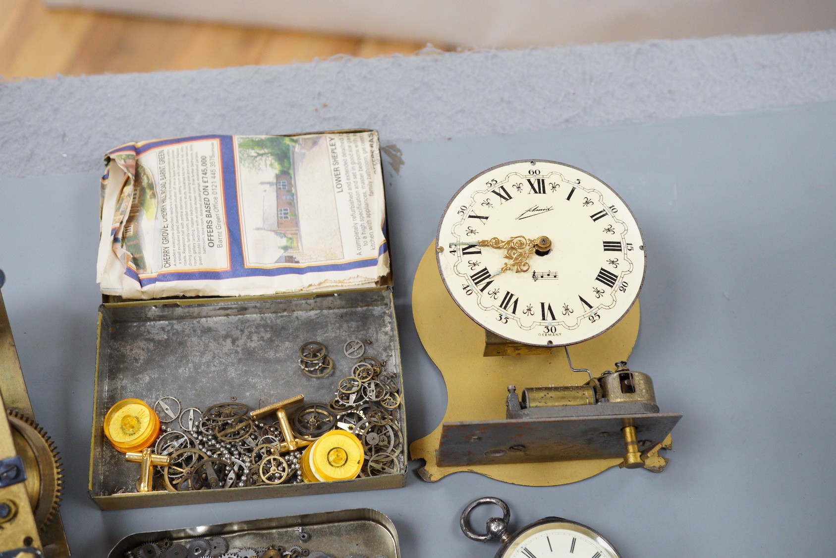 A silver pocket watch, various wrist watches and watch and clock parts and movements